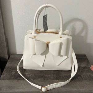 White Crossi brand hand bag